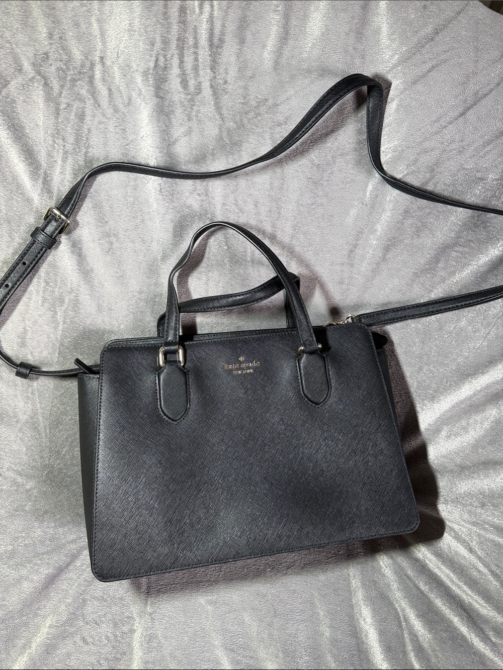 Kate spade black bag used mostly for office wear. Has lots of pockets for storag